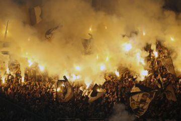 Partizan soccer fans light torches during a Serbian National soccer league derby match between Partizan and Red Star, in Belgrade, Serbia, Saturday, Sept. 17, 2016.