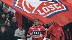 Lille's Canadian forward Jonathan David celebrates after scoring his first goal during the French L1 football match between Lille LOSC and Olympique Lyonnais (OL) at Stade Pierre-Mauroy in Villeneuve-d'Ascq, northern France, on March 10, 2023. (Photo by Sameer Al-DOUMY / AFP)