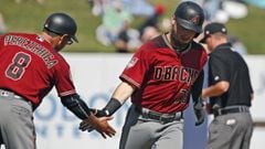 Arizona Diamondbacks&#039; Wyatt Mathisen (76) is congratulated by third base coach Tony Perezchica (8) after hitting a solo home run in the seventh inning of a spring training baseball game against the Milwaukee Brewers, Friday, March 8, 2019, in Phoenix