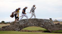 Golf - The 150th Open Championship - Old Course, St Andrews, Scotland, Britain - July 16, 2022 Northern Ireland's Rory McIlroy and Norway's Viktor Hovland walk over the Swilken Bridge on the 18th during the third round REUTERS/Paul Childs