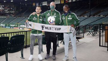 Dec 9, 2021; Portland, OR, USA; Portland Timbers midfielder Sebastian Blanco (10), head coach Giovanni Savarese, and Yimmi Chara (23) pose for a photo during a press conference at Providence Park. Mandatory Credit: Soobum Im-USA TODAY Sports