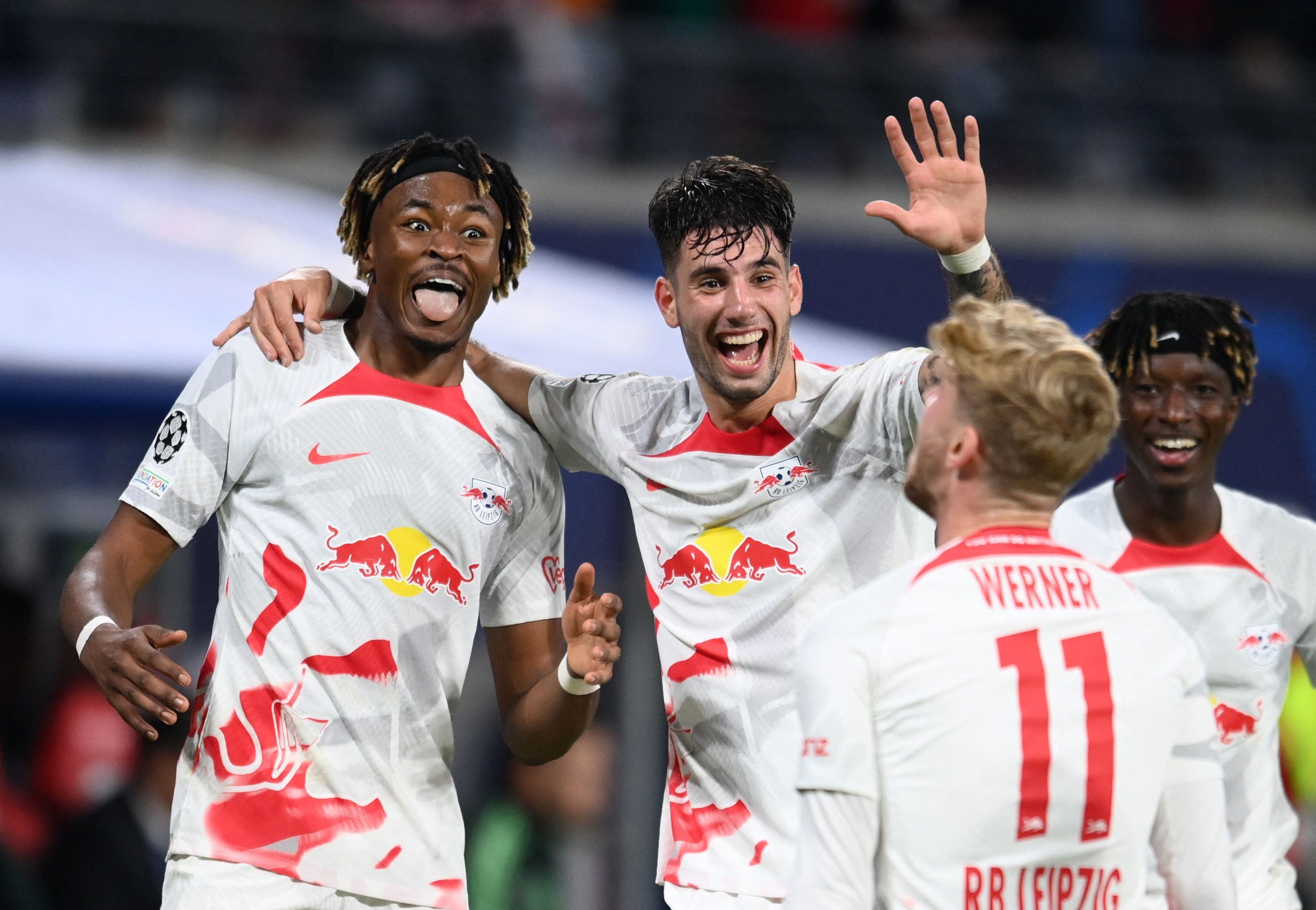 Soccer Football - Champions League - Group F - RB Leipzig v Real Madrid - Red Bull Arena, Leipzig, Germany - October 25, 2022 RB Leipzig's Timo Werner celebrates scoring their third goal with Mohamed Simakan and Dominik Szoboszlai REUTERS/Annegret Hilse