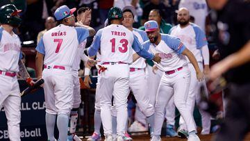 PHOENIX, ARIZONA - MARCH 14: Alan Trejo #13 of Team Mexico celebrates with teammates after scoring against Team Great Britain during the seventh inning of the World Baseball Classic Pool C game at Chase Field on March 14, 2023 in Phoenix, Arizona.   Chris Coduto/Getty Images/AFP (Photo by Chris Coduto / GETTY IMAGES NORTH AMERICA / Getty Images via AFP)
