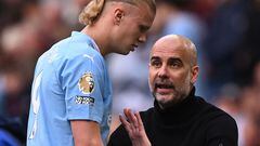 Manchester City's Spanish manager Pep Guardiola (R) gestures to Manchester City's Norwegian striker #09 Erling Haaland during the English Premier League football match between Manchester City and Nottingham Forest at the Etihad Stadium in Manchester, north west England, on September 23, 2023. (Photo by Oli SCARFF / AFP) / RESTRICTED TO EDITORIAL USE. No use with unauthorized audio, video, data, fixture lists, club/league logos or 'live' services. Online in-match use limited to 120 images. An additional 40 images may be used in extra time. No video emulation. Social media in-match use limited to 120 images. An additional 40 images may be used in extra time. No use in betting publications, games or single club/league/player publications. / 