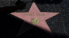 A woman uses her mobile phone  to make images of late actor James Caan's star on the Hollywood Walk of Fame, Los Angeles, California, U.S., July 7, 2022 REUTERS/Mario Anzuoni