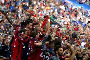 Pepe of Portugal (c) lifts the Henri Delaunay trophy after his side win 1-0 against France during the UEFA EURO 2016 Final match between Portugal and France at Stade de France on July 10, 2016 in Paris, France