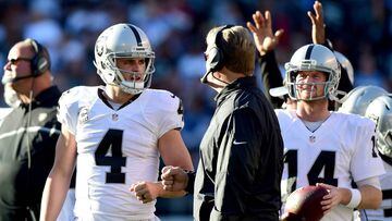SAN DIEGO, CA - DECEMBER 18: Derek Carr #4 of the Oakland Raiders talks with head coach Jack Del Rio during a video replay challenge resulting in a touchdown to Michael Crabtree #15 during the second quarter against the San Diego Chargers at Qualcomm Stadium on December 18, 2016 in San Diego, California.   Harry How/Getty Images/AFP == FOR NEWSPAPERS, INTERNET, TELCOS &amp; TELEVISION USE ONLY ==