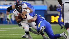 INGLEWOOD, CALIFORNIA - DECEMBER 25: Russell Wilson #3 of the Denver Broncos is sacked during the second half of the game against the Los Angeles Rams at SoFi Stadium on December 25, 2022 in Inglewood, California.   Jayne Kamin-Oncea/Getty Images/AFP (Photo by Katelyn Mulcahy / GETTY IMAGES NORTH AMERICA / Getty Images via AFP)