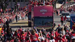 Feb 14, 2024; Kansas City, MO, USA; Kansas City Chiefs owner Clark Hunt and wife Tavia Hunt and coach Andy Reid ride on a bus during the celebration of the Chiefs winning Super Bowl LVIII. Mandatory Credit: Kirby Lee-USA TODAY Sports