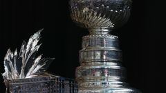 DENVER, COLORADO - JUNE 14: The Conn Smythe Trophy and the Stanley Cup are on display during the 2022 NHL Stanley Cup Final Media Day