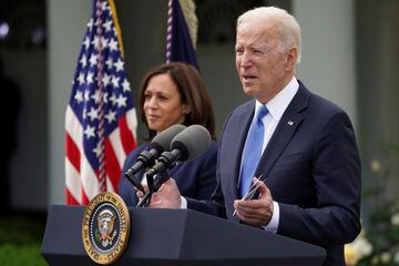 Joe Biden, accompanied by Kamala Harris, speaks about the coronavirus disease response and the vaccination program from the Rose Garden of the White House.