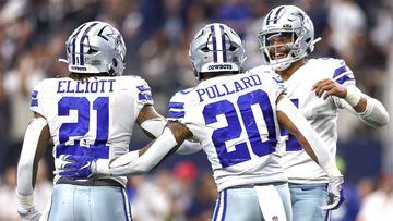 ARLINGTON, TEXAS - OCTOBER 23: Dak Prescott #4 of the Dallas Cowboys celebrates with Ezekiel Elliott #21 and Tony Pollard #20 after a touchdown against the Detroit Lions during the fourth quarter at AT&T Stadium on October 23, 2022 in Arlington, Texas.   Tom Pennington/Getty Images/AFP