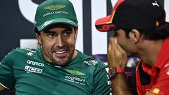 Aston Martin�s Spanish driver Fernando Alonso (L) reacts to something Ferrari's Spanish driver Carlos Sainz Jr (R) said as they take part in a press conference ahead of the Singapore Formula One Grand Prix night race at the Marina Bay Street Circuit in Singapore on September 14, 2023. (Photo by Lillian SUWANRUMPHA / AFP)