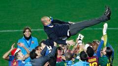 Players of Spain's Barcelona throw their head coach Pep Guardiola in the air as they celebrate after winning their Club World Cup final soccer match against Brazil's Santos in Yokohama, south of Tokyo December 18, 2011.   REUTERS/Issei Kato (JAPAN - Tags: SPORT SOCCER)