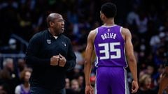 Sacramento Kings head coach Mike Brown talks with guard PJ Dozier (35)