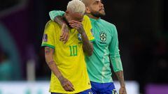 AL RAYYAN, QATAR - DECEMBER 09: Neymar of Brazil is consoled by team mate Dani Alves following the FIFA World Cup Qatar 2022 quarter final match between Croatia and Brazil at Education City Stadium on December 9, 2022 in Al Rayyan, Qatar. (Photo by Visionhaus/Getty Images)