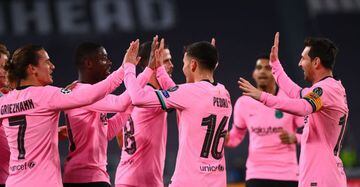 Ousmane Dembele (2nd L)) celebrates with teammates scoring his team's first goal during the UEFA Champions League Group G football match between Juventus and Barcelona on October 28, 2020.