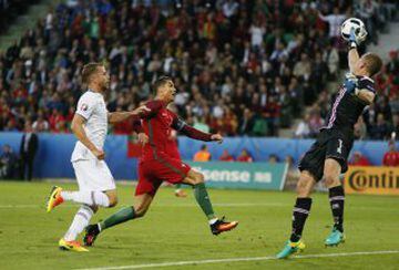 Cristiano Ronaldo looks to challenge keeper Hannes Halldorsson.