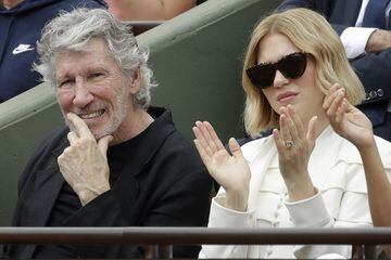 British musician and member of the Pink Floyd band Roger Waters and French actrice Lea Seydoux watch the men's final match of the French Open tennis tournament at the Roland Garros stadium in Paris, France, Sunday, June 10, 2018. (AP Photo/Alessandra Tarantino)