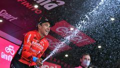 Cycling - Giro d'Italia - Stage 17 - Ponte di Legno to Lavarone, Italy - May 25, 2022 Bahrain - Victorious' Santiago Buitrago celebrates on the podium after winning stage 17 REUTERS/Jennifer Lorenzini