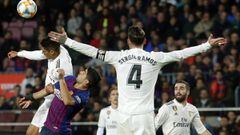 Real Madrid&#039;s French defender Raphael Varane (L TOP) vies with Barcelona&#039;s Uruguayan forward Luis Suarez during the Spanish Copa del Rey (King&#039;s Cup) semi-final first leg football match between FC Barcelona and Real Madrid CF at the Camp No