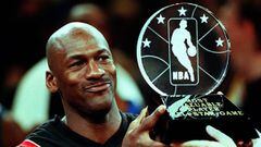 Chicago Bulls&#039; Michael Jordan holds up the Most Valuable Player trophy which he earned in leading the Eastern Conference to victory in the NBA All-Star Game at Madison Square Garden 08 February. Jordan won his third MVP award by scoring 23 points as 