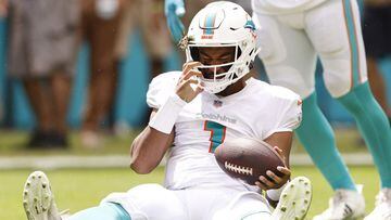 MIAMI GARDENS, FLORIDA - SEPTEMBER 19: Tua Tagovailoa #1 of the Miami Dolphins reacts after being sacked against the Buffalo Bills during the first quarter at Hard Rock Stadium on September 19, 2021 in Miami Gardens, Florida.   Michael Reaves/Getty Images