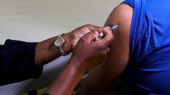 FILE PHOTO: A healthcare worker administers the Pfizer coronavirus disease (COVID-19) vaccine to a man, amidst the spread of the SARS-CoV-2 variant Omicron, in Johannesburg, South Africa, December 9, 2021. REUTERS/Sumaya Hisham/File Photo