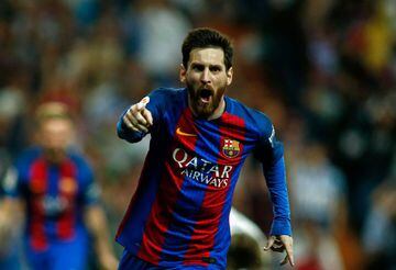 Barcelona's Argentinian forward Lionel Messi celebrates after scoring during the Spanish league Clasico football match Real Madrid CF vs FC Barcelona at the Santiago Bernabeu stadium in Madrid on April 23, 2017