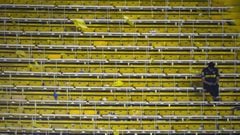 BUENOS AIRES, ARGENTINA - OCTOBER 22: A fan of Boca Juniors sits in the empty stands after the Semifinal second leg match between Boca Juniors and River Plate as part of Copa CONMEBOL Libertadores 2019 at Estadio Alberto J. Armando on October 22, 2019 in Buenos Aires, Argentina. (Photo by Marcelo Endelli/Getty Images)