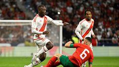 Peru's Luis Advincula (L) vies with Morocco's defender Saiss Ghanem during the friendly football match between Morocco and Peru at the Wanda Metropolitano stadium in Madrid on March 28, 2023. (Photo by JAVIER SORIANO / AFP) (Photo by JAVIER SORIANO/AFP via Getty Images)