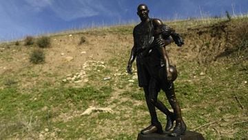A bronze sculpture by artist Dan Medina, depicting Kobe Bryant, daughter Gianna Bryant, and the names of those who died, is displayed as a one-day temporary memorial at the site of a 2020 helicopter crash in Calabasas, California, on January 26, 2022. - L