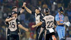 New Zealand players celebrate after defeating India. 