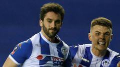 Soccer Football - FA Cup Fifth Round - Wigan Athletic vs Manchester City - DW Stadium, Wigan, Britain - February 19, 2018   Wigan Athletic&rsquo;s Will Grigg celebrates scoring their first goal with Max Power    REUTERS/Andrew Yates