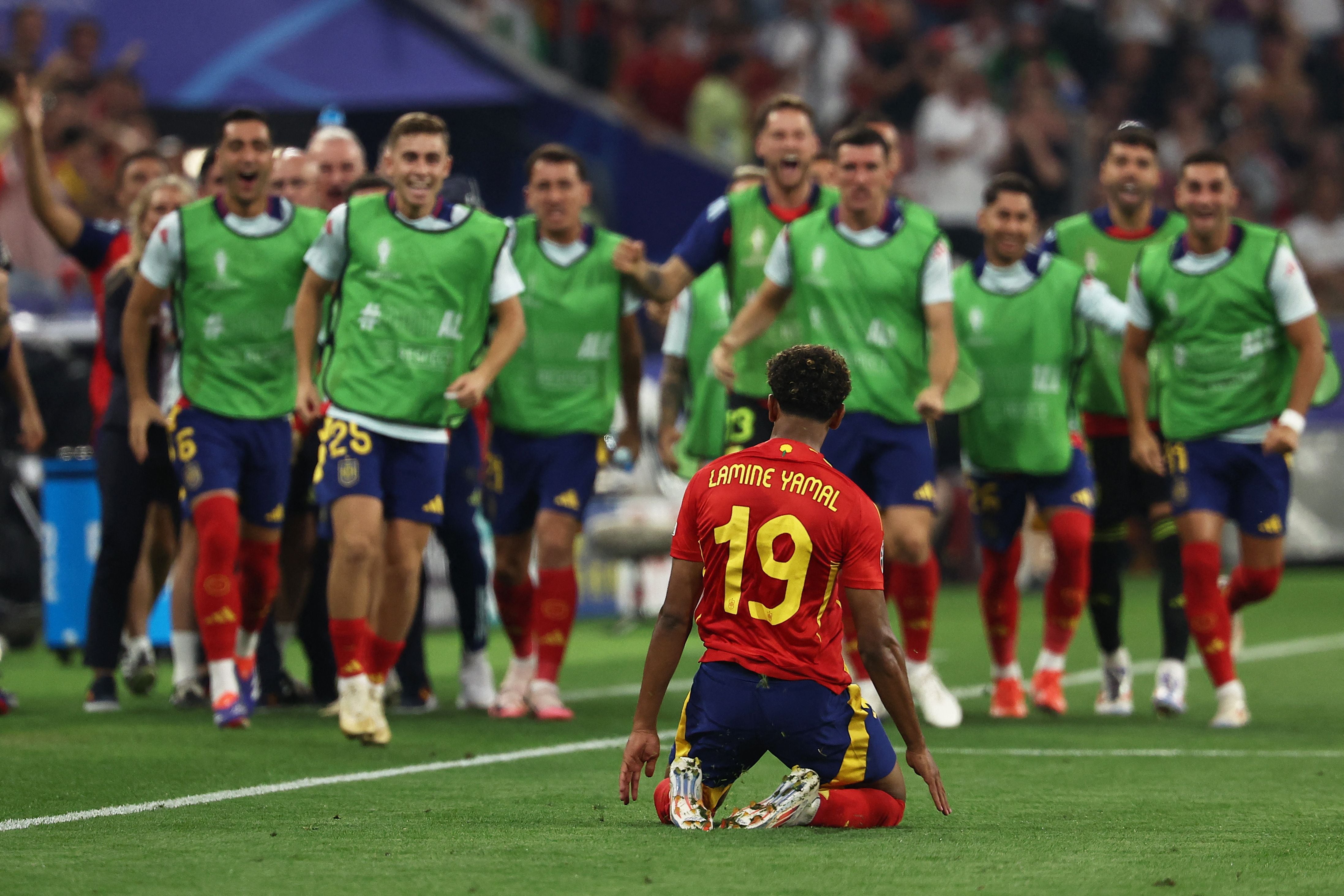 TOPSHOT - Spain's forward #19 Lamine Yamal celebrates scoring his team's first goal during the UEFA Euro 2024 semi-final football match between Spain and France at the Munich Football Arena in Munich on July 9, 2024. (Photo by FRANCK FIFE / AFP)