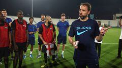 DOHA, QATAR - NOVEMBER 17: England Manager Gareth Southgate speaks with migrant workers at Al Wakrah Stadium on November 17, 2022 in Doha, Qatar. (Photo by Eddie Keogh - The FA/The FA via Getty Images)