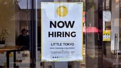 Photo taken on May 28, 2021 a &#039;Now Hiring&#039; sign is posted in front of an ice-cream shop in Los Angeles, California. - 