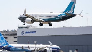 (FILES) In this file photo taken on June 29, 2020 A Boeing 737 MAX jet lands following Federal Aviation Administration (FAA) test flight at Boeing Field in Seattle, Washington on June 29, 2020. - Boeing on August 11, 200, reported another 43 cancelled ord