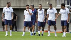 Paris Saint-Germain soccer players, from left, Sergio Ramos, Lionel Messi, coach Christophe Galtier, Neymar, Kylian Mbappe and Marquinhos walk to participate during a PSG soccer lesson Monday, July 18, 2022, in Tokyo. Paris Saint-Germain is in Japan for their pre-season tour and will play three friendly matches against Japan's J1 League teams. (AP Photo/Eugene Hoshiko)