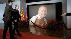 FC Barcelona's president Josep Maria Bartomeu (L) and Real Madrid president Florentino Perez (R) walk past a picture of soccer great Johan Cruyff during a memorial at Camp Nou stadium in Barcelona, Spain, March 26, 2016. REUTERS/Albert Gea EDITORIAL USE O