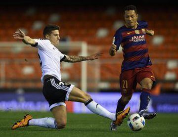 Adriano  of Barcelona is tackled by Santi Mina of Valencia during the Copa del Rey Semi Final