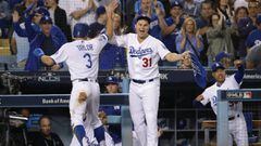 LOS ANGELES, CA - OCTOBER 16: Joc Pederson #31 of the Los Angeles Dodgers congratulates teammate Chris Taylor #3 with a high five after Taylor scored during the first inning of Game Four of the National League Championship Series against the Milwaukee Bre