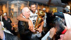 SAN ANTONIO, TX - JUNE 15: Head Coach Gregg Popovich and Tim Duncan #21 of the San Antonio Spurs celebrate in the locker room with the Larry O&#039;Brien trophy after defeating the Miami Heat to win the 2014 NBA Finals in Game Five of the 2014 NBA Finals 