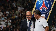 Luis Campos (L), Portuguese Football Advisor for French club Paris Saint-Germain, celebrates with Paris Saint-Germain's French head coach Christophe Galtier after the team won the French Champions' Trophy (Trophee des Champions) final football match, Paris Saint-Germain versus FC Nantes, in the at the Bloomfield Stadium, in Tel Aviv on July 31, 2022. - Paris Saint-Germain (PSG) beat Nantes 4-0 to clinch the trophy. (Photo by JACK GUEZ / AFP)