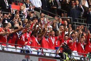 Nottingham Forest's Lewis Grabban lifts the trophy following the side's victory Championship playoff final win over Huddersfield Town.