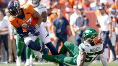 Noah Fant #87 of the Denver Broncos is tackled by C.J. Mosley #57 of the New York Jets at Empower Field At Mile High on September 26, 2021, in Denver, Colorado. 