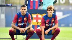 Portuguese forward Joao Felix (R) and defender Joao Cancelo pose during their official presentation as new players of FC Barcelona at the Joan Gamper training ground in Sant Joan Despi, near Barcelona, on September 2, 2023. Barcelona signed Atletico Madrid forward Joao Felix and Manchester City defender Joao Cancelo on loan until the end of the season, the Spanish champions. (Photo by Pau BARRENA / AFP)