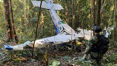 A soldier stands next to the wreckage of a plane during the search for child survivors from a Cessna 206 plane that crashed in the jungle more than two weeks ago in the jungles of Caqueta, Colombia May 19, 2023. Colombian Military Forces/Handout via REUTERS  ATTENTION EDITORS - THIS IMAGE WAS PROVIDED BY A THIRD PARTY. MANDATORY CREDIT. NO RESALES. NO ARCHIVES