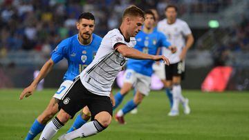 Germany&#039;s midfielder Joshua Kimmich (C) outflanks Italy&#039;s midfielder Lorenzo Pellegrini during the UEFA Nations League - League A, Group 3 first leg football match between Italy and Germany on June 4, 2022 at the Renato Dall&#039;Ara stadium in 