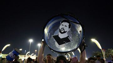 FILE PHOTO: Soccer Football - FIFA World Cup Qatar 2022 - Doha, Qatar - November 25, 2022  An Argentina fan holds up his drum with an image of Lionel Messi on it on the Doha Corniche REUTERS/Lee Smith/File Photo